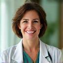 Dr. Lena Khan, a female wellness professional, smiling